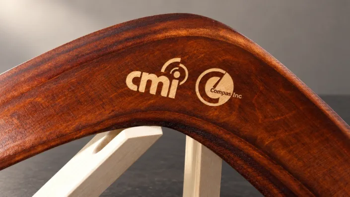 Light engraved company logos — illustration Illustration of light engraved company logos on a dark wooden boomerang.