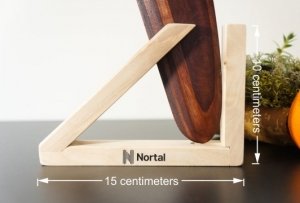 black company logo is engraved on wooden stand for boomerang