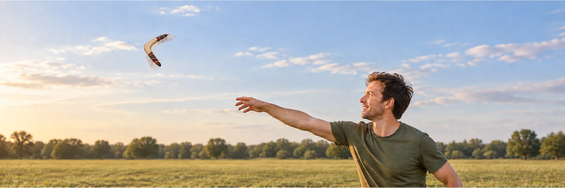 Banner illustration of a man releasing a wooden boomerang over an open grass field